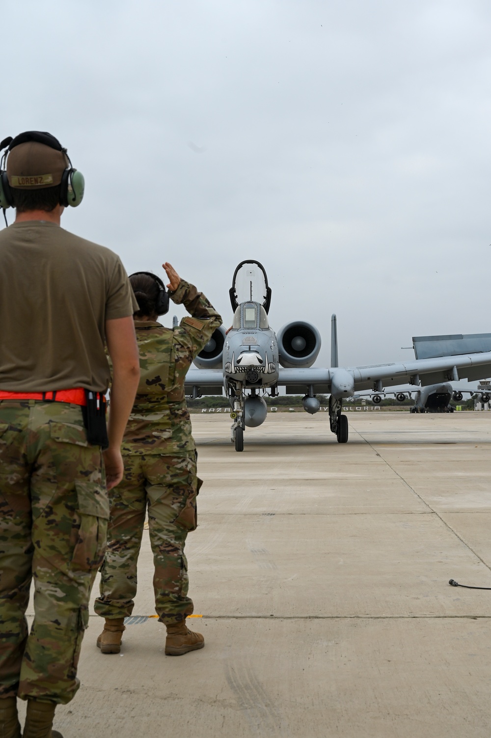 Multi-capable Airman trains on aircraft marshaling