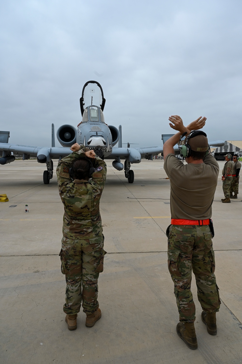 Multi-capable Airman trains on aircraft marshaling