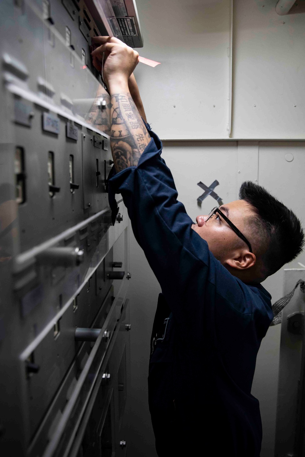 USS Ralph Johnson (DDG 114) Sailors perform VCHT Maintenance.