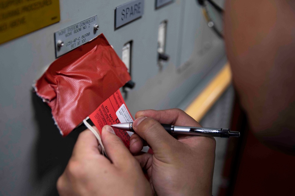 USS Ralph Johnson (DDG 114) Sailors perform VCHT Maintenance.