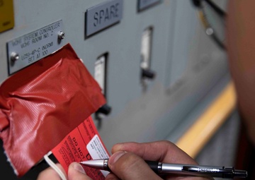 USS Ralph Johnson (DDG 114) Sailors perform VCHT Maintenance.