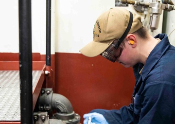 USS Ralph Johnson (DDG 114) Sailors perform VCHT Maintenance.
