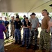 Volunteers receive direction during an international outreach project on Guam.