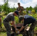 Sailors from four different national navies work together to complete a volunteer project on Guam