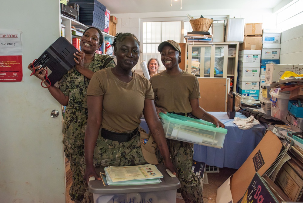 U.S. Navy Sailors pose during a community outreach project at Island Girl Power on Guam