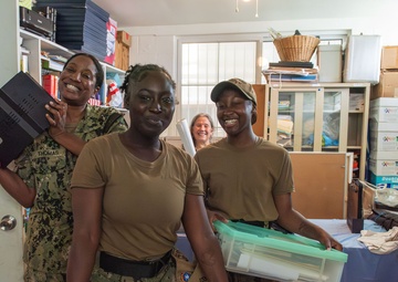 U.S. Navy Sailors pose during a community outreach project at Island Girl Power on Guam