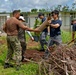 Sailors from multiple nations volunteer together during an international community outreach event