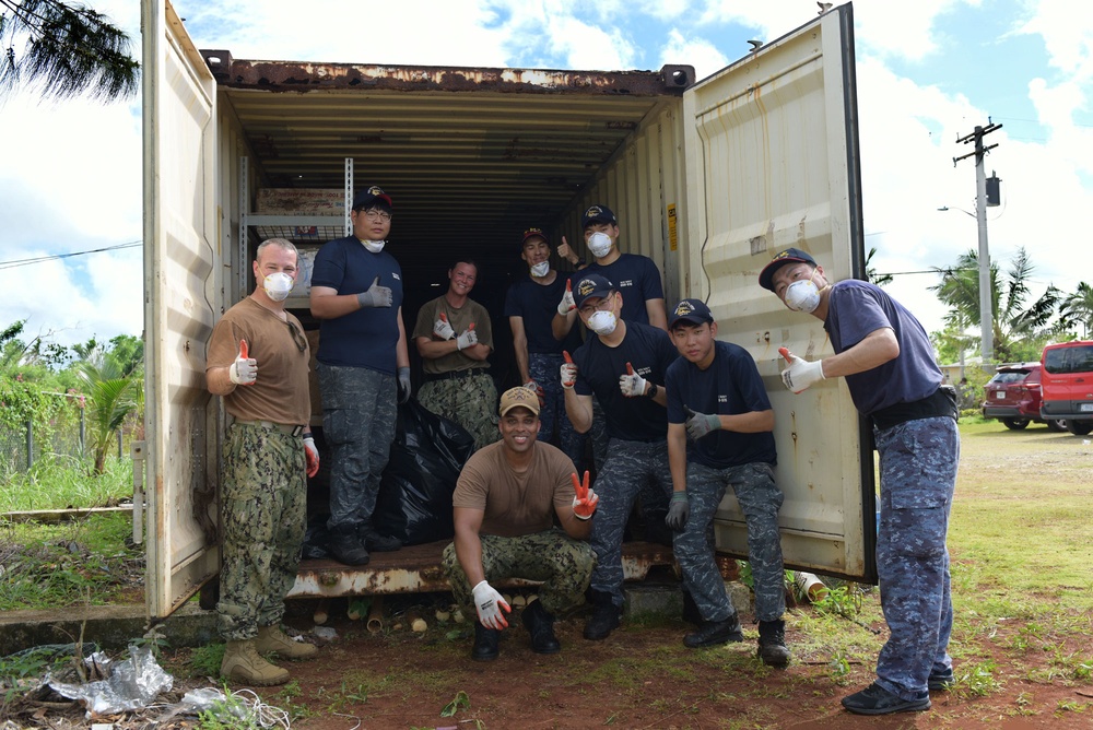 Sailors from the U.S. Navy and Republic of Korea Navy Pose together during a community volunteer project