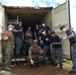 Sailors from the U.S. Navy and Republic of Korea Navy Pose together during a community volunteer project