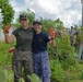 Sailors from the Japan Maritime Self-Defense Force and Republic of Korea Navy volunteer together during a community outreach event