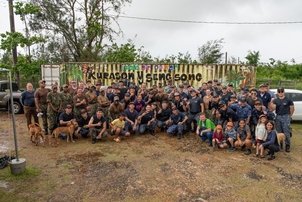 Sailors from four nations come together for a community outreach project at Island Girl Power on Guam