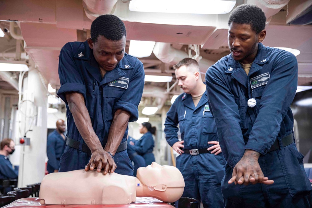 Sailors practice CPR techniques aboard the Arleigh Burke-class guided-missile destroyer USS Ralph Johnson (DDG 114).