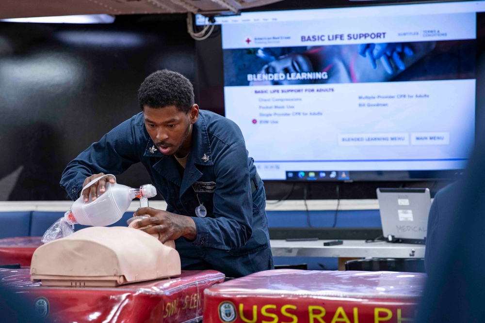 Sailors practice CPR techniques aboard the Arleigh Burke-class guided-missile destroyer USS Ralph Johnson (DDG 114).