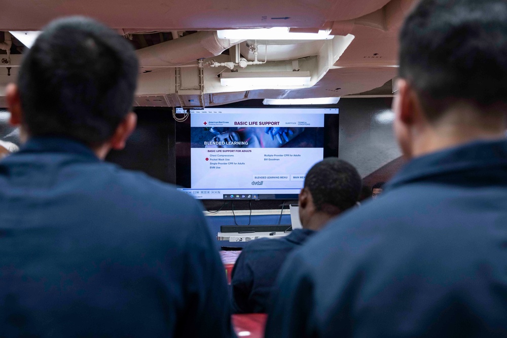 Sailors practice CPR techniques aboard the Arleigh Burke-class guided-missile destroyer USS Ralph Johnson (DDG 114).