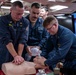 Sailors practice CPR techniques aboard the Arleigh Burke-class guided-missile destroyer USS Ralph Johnson (DDG 114).