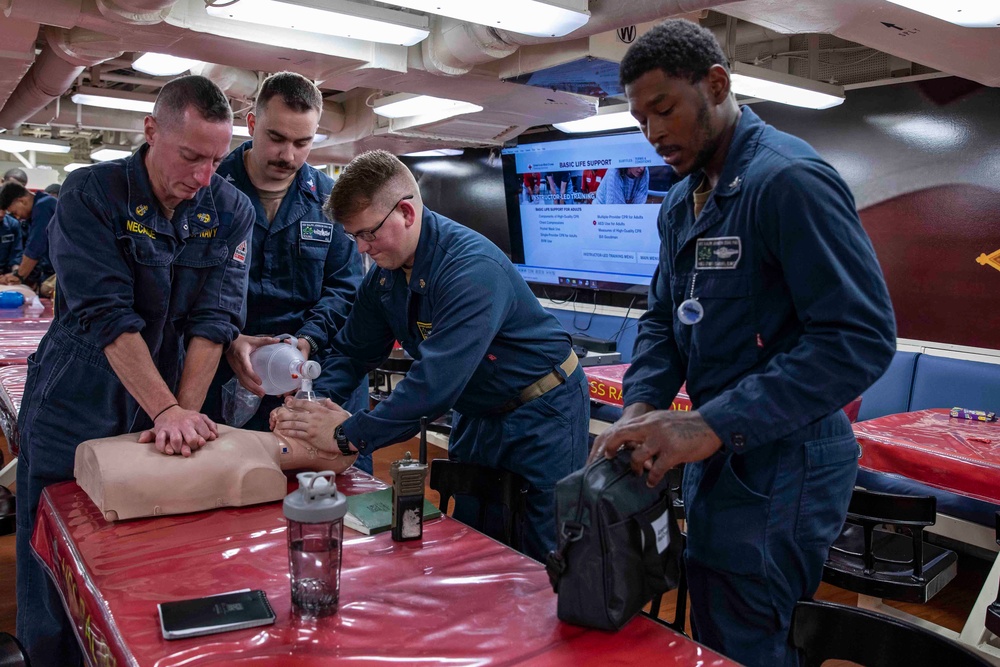 Sailors practice CPR techniques aboard the Arleigh Burke-class guided-missile destroyer USS Ralph Johnson (DDG 114).