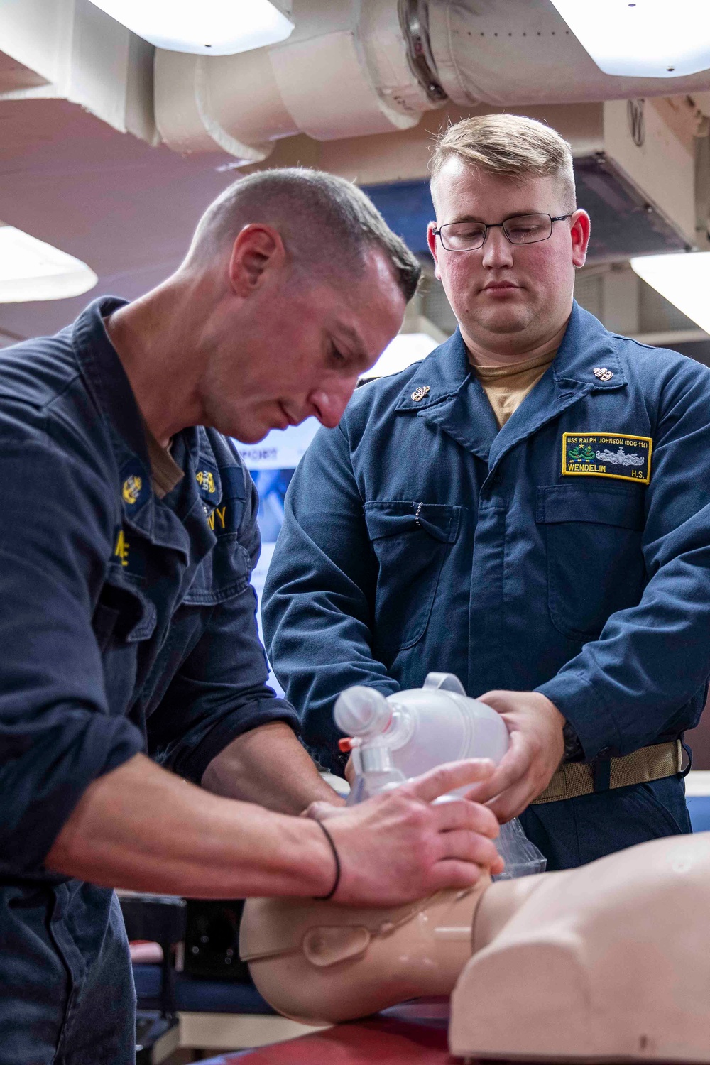 Sailors practice CPR techniques aboard the Arleigh Burke-class guided-missile destroyer USS Ralph Johnson (DDG 114).