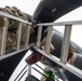 901 SOAMXS airmen carry out routine maintenance on MC-130J