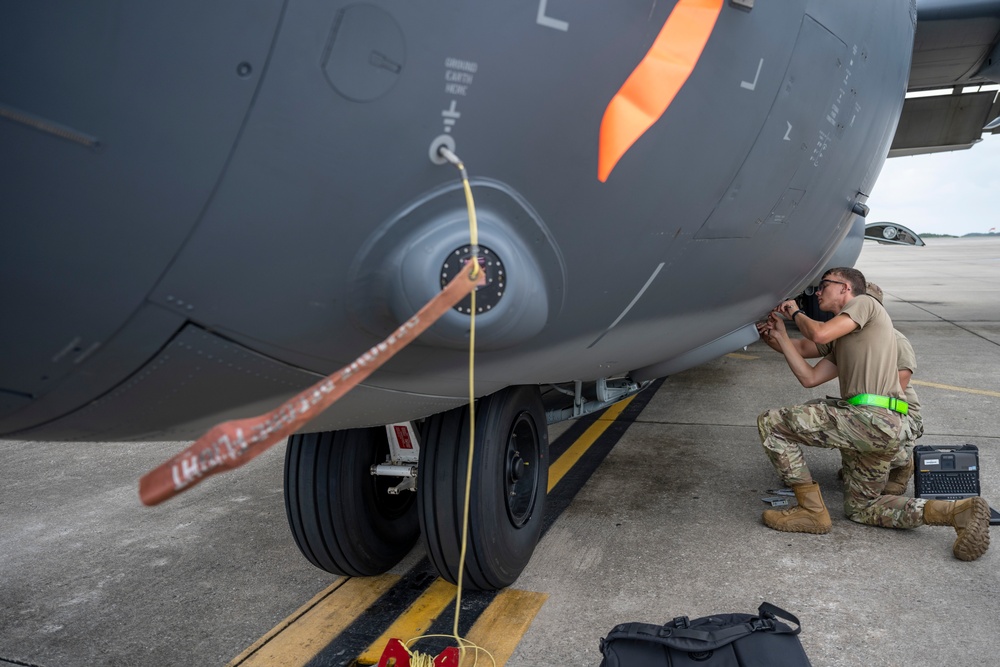 901 SOAMXS airmen carry out routine maintenance on MC-130J