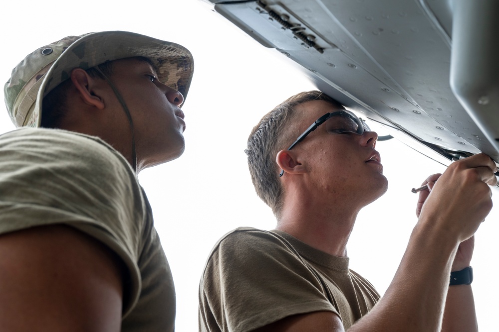 901 SOAMXS airmen carry out routine maintenance on MC-130J