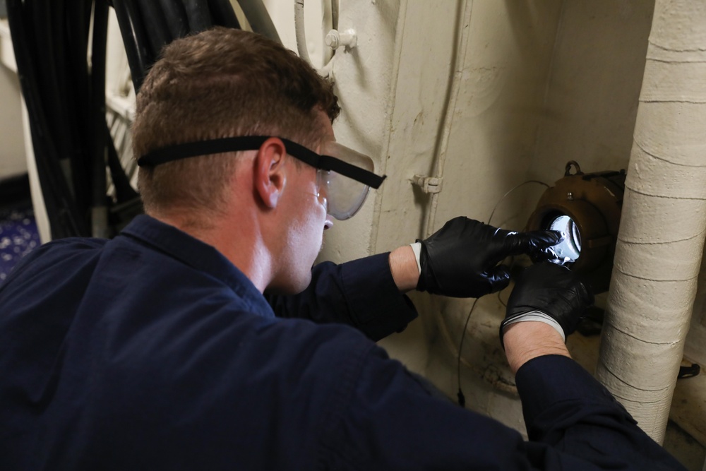 Sailor Performs Routine Maintenance