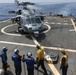 Sailors Show Gear To Pilot