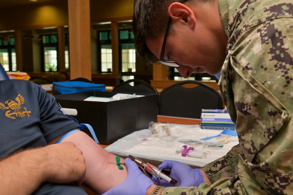 NAS Sigonella Corpsman draws blood for Walking Blood Bank