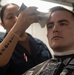 USS Ronald Reagan (CVN 76) Sailors get haircuts