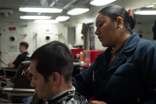 USS Ronald Reagan (CVN 76) Sailors get haircuts