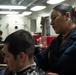 USS Ronald Reagan (CVN 76) Sailors get haircuts