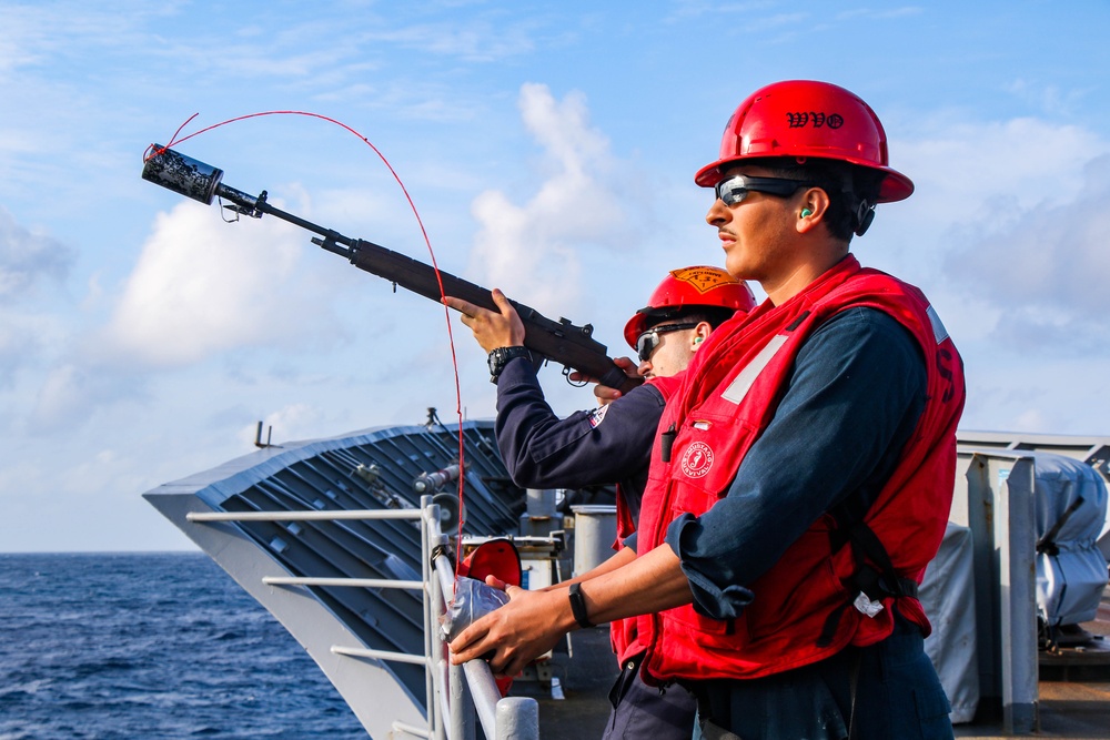 USS Robert Smalls (CG 62) Sailor Shoots Shot Line during RAS