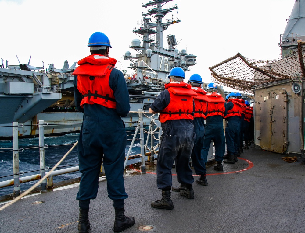 USS Robert Smalls (CG 62) Sailors Hold the Line during RAS with USS Ronald Reagan