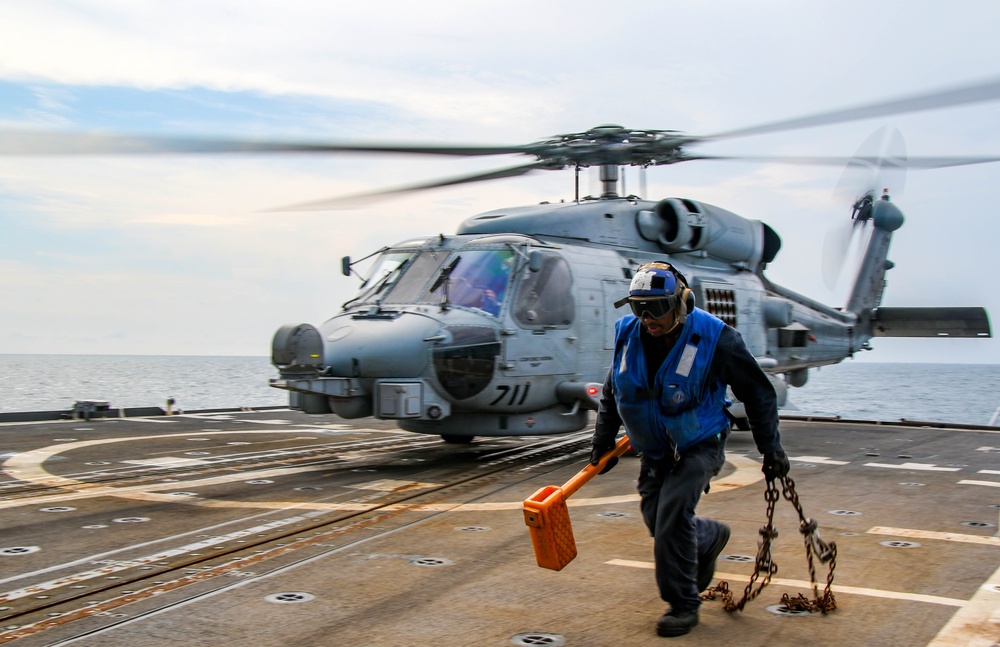 USS Robert Smalls (CG 62) Sailors Grabs Chock and Chains during Flight Quarters