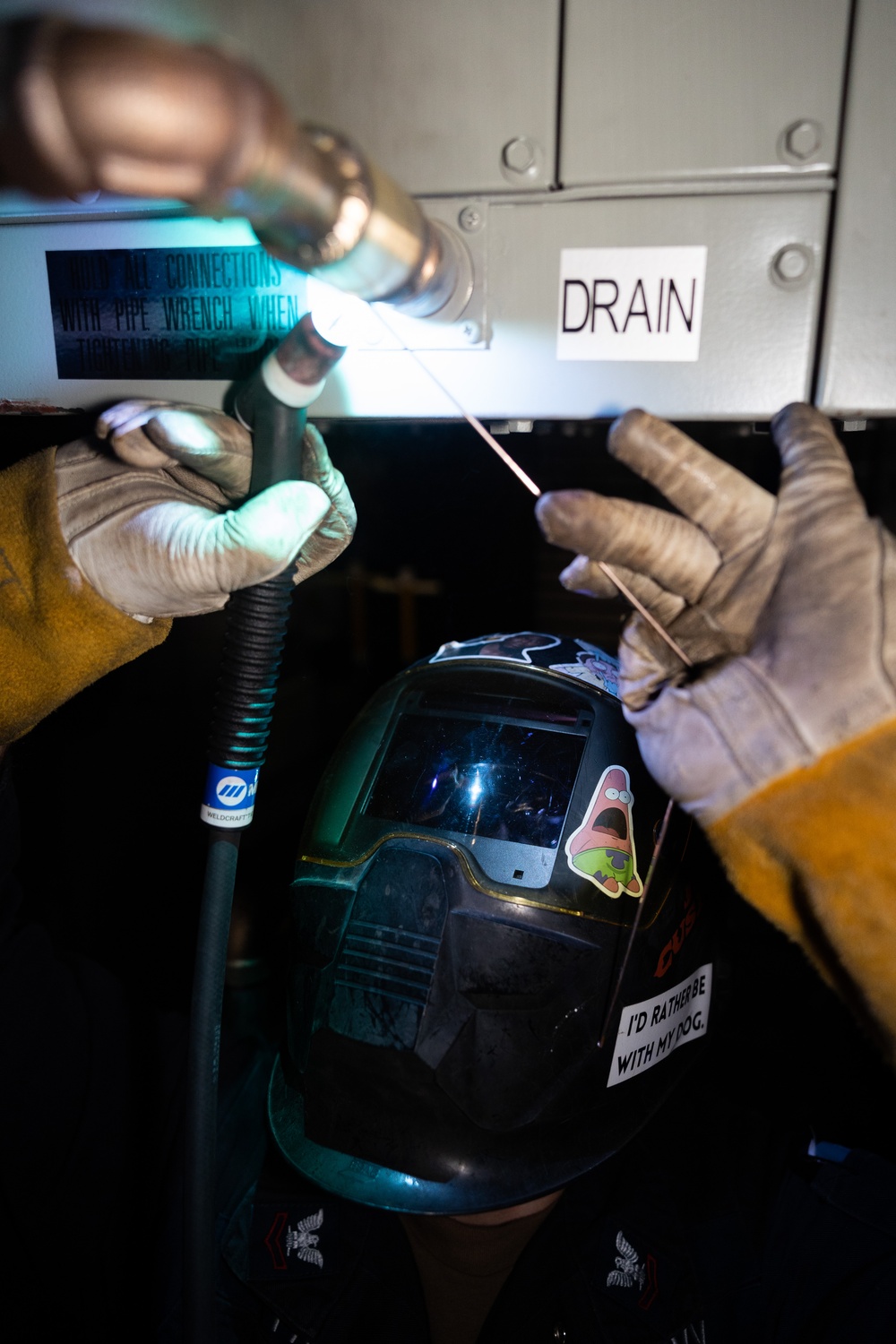 BATAAN SAILORS INSTALL A FAN COIL UNIT