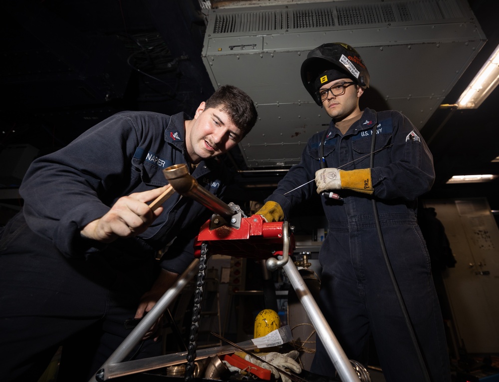 BATAAN SAILORS INSTALL A FAN COIL UNIT