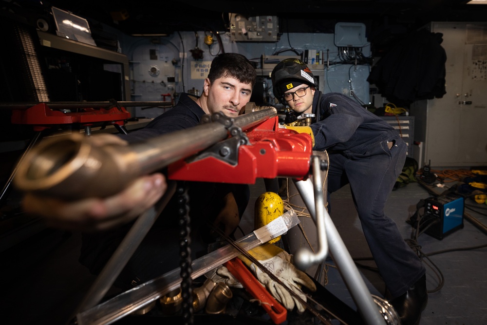 BATAAN SAILORS INSTALL A FAN COIL UNIT