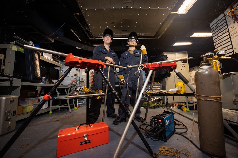 BATAAN SAILORS INSTALL A FAN COIL UNIT