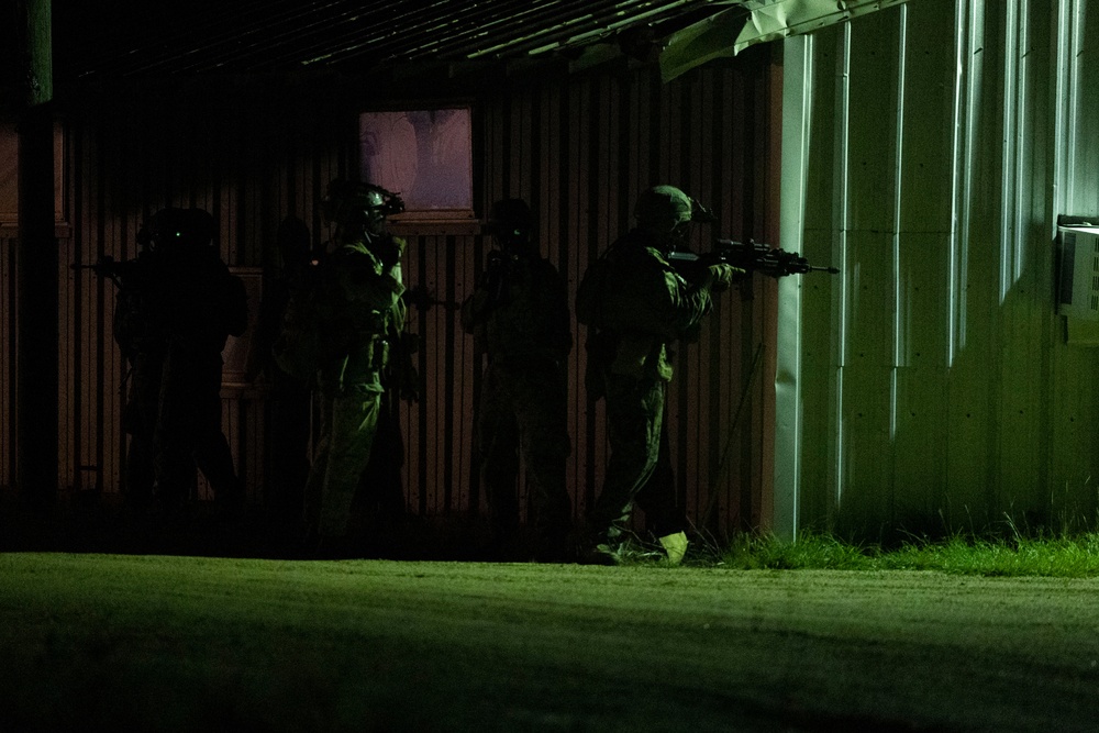 Marine Raiders conduct a direct action raid during Exercise Raven