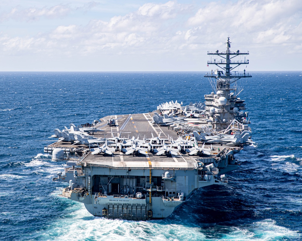 USS Ronald Reagan (CVN 76) steams in formation with Indonesian navy ships KRI Sultan Hasanuddin (366) and KRI Sultan Iskandar Muda (367)