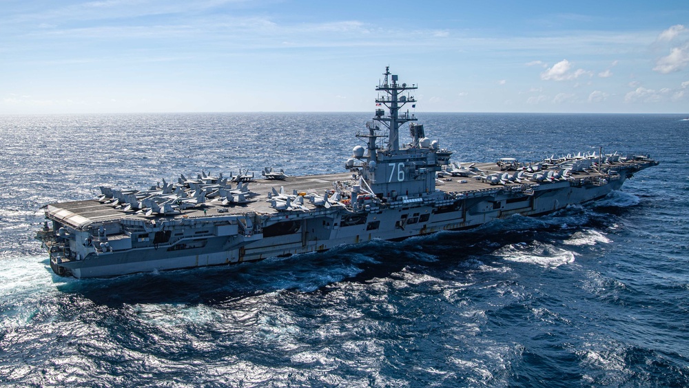 USS Ronald Reagan (CVN 76) steams in formation with Indonesian navy ships KRI Sultan Hasanuddin (366) and KRI Sultan Iskandar Muda (367)