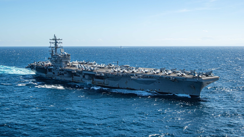 USS Ronald Reagan (CVN 76) steams in formation with Indonesian navy ships KRI Sultan Hasanuddin (366) and KRI Sultan Iskandar Muda (367)