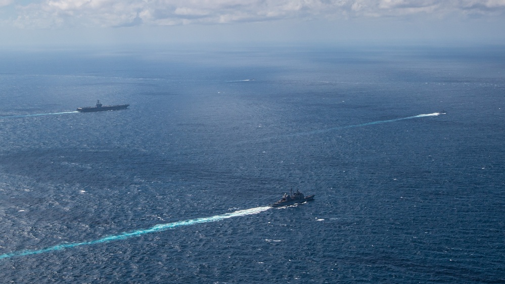 USS Ronald Reagan (CVN 76) steams in formation with Indonesian navy ships KRI Sultan Hasanuddin (366) and KRI Sultan Iskandar Muda (367)