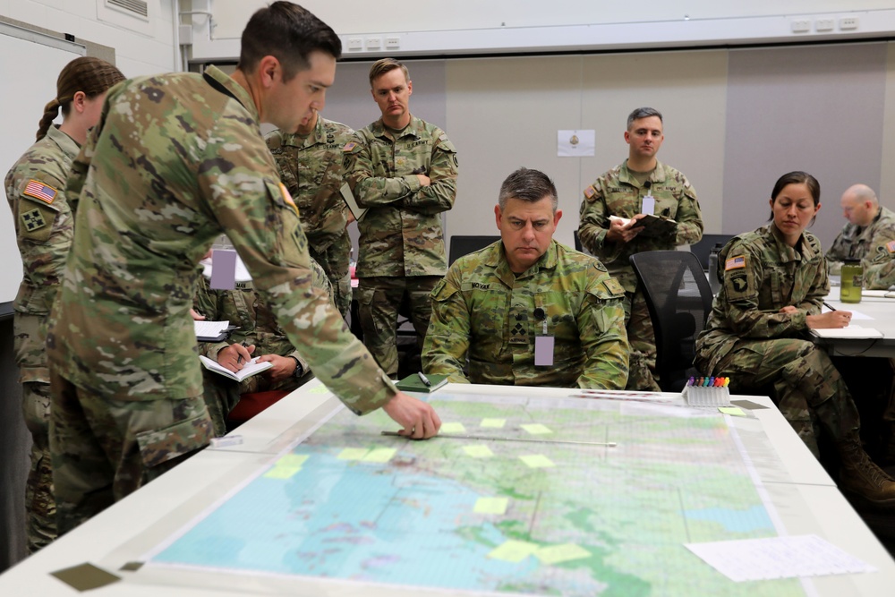 Brigadier Gregory Novak, 6th Combat Support Brigade commander, Australian Army, receives Task Force 660’s first official brief of Talisman Sabre 23