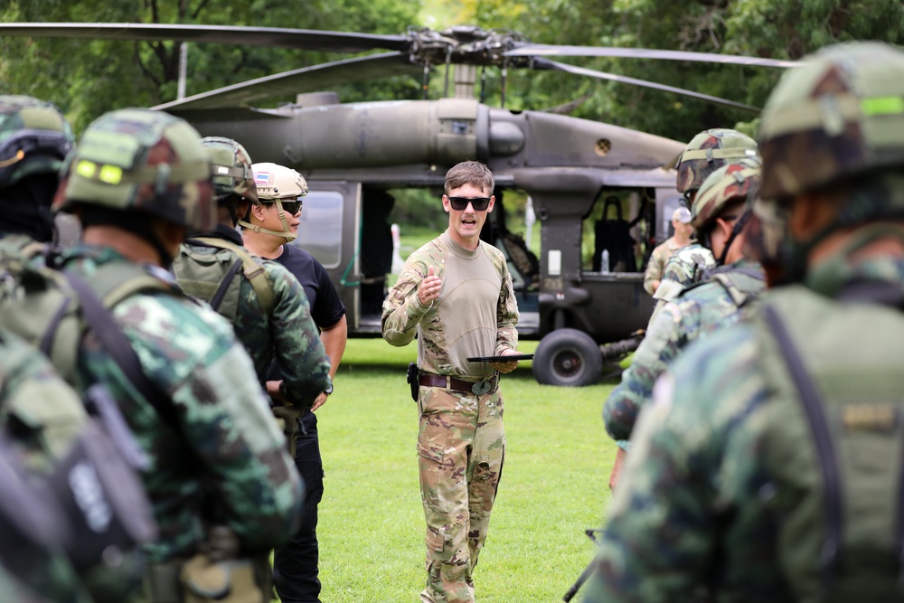 A U.S. Army Soldier shares best practices with Royal Thai Army soldiers on air assault operations during Hanuman Guardian 2023