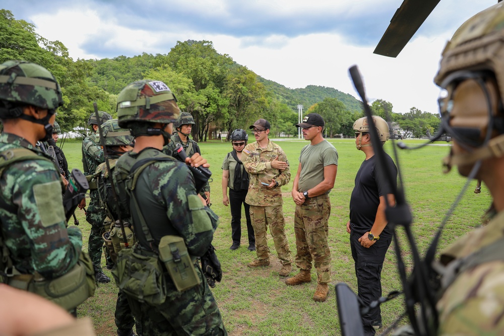 U.S. Army Soldiers of the 25th Combat Aviation Brigade brief Royal Thai Army soldiers on CH-47 Chinook helicopter air assault operations during Hanuman Guardian 2023