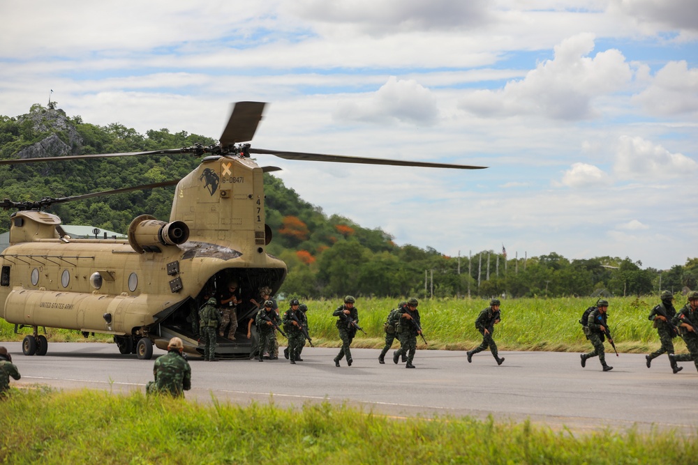 Royal Thai Army soldiers exit a U.S. Army CH-47 Chinook helicopter during air assault operations as part of Exercise Hanuman Guardian 2023