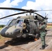 Military members from seven countries listen to a safety briefing ahead of Fast Rope Insertion and Extraction System (FRIES) training at Air Base London, Guyana, on July 17, 2023