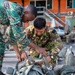U.S. and Multinational Partners prepare parachutes to jump out of a C-130 during TRADEWINDS 2023