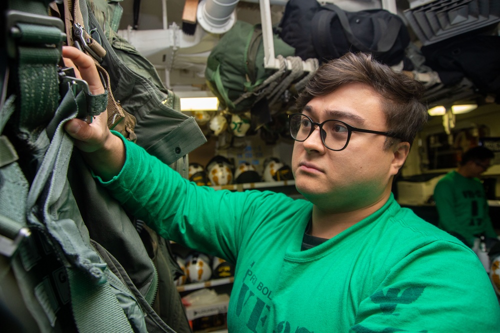 USS Ronald Reagan (CVN 76) squadrons perform equipment maintenance and inspections.