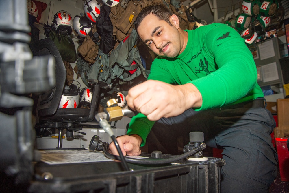 USS Ronald Reagan (CVN 76) squadrons perform equipment maintenance and inspections.